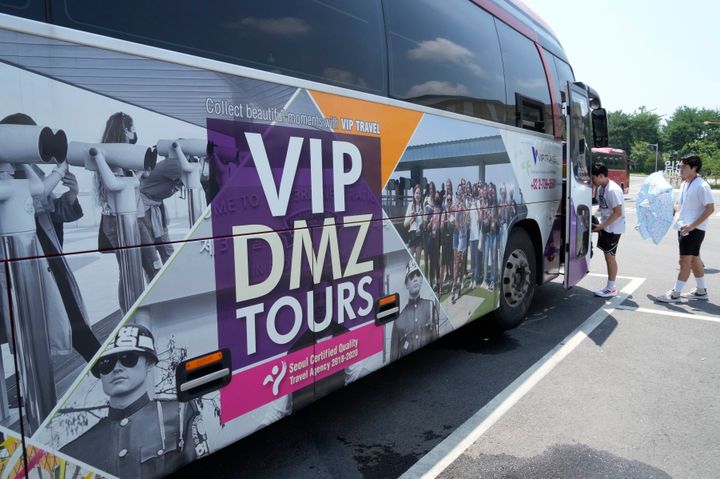 A banner advertising a DMZ tour is attached at a tourist bus at the Imjingak Pavilion in Paju, South Korea, near the border with North Korea, on July 19, 2023. 