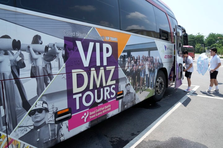 A banner advertising a DMZ tour is attached at a tourist bus at the Imjingak Pavilion in Paju, South Korea, near the border with North Korea, on July 19, 2023.