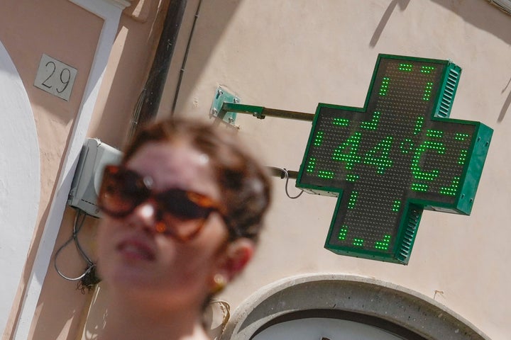 A pharmacy thermometer detects the temperature of 44 degrees Celsius near Spanish Steps in Rome, on July 18, 2023.