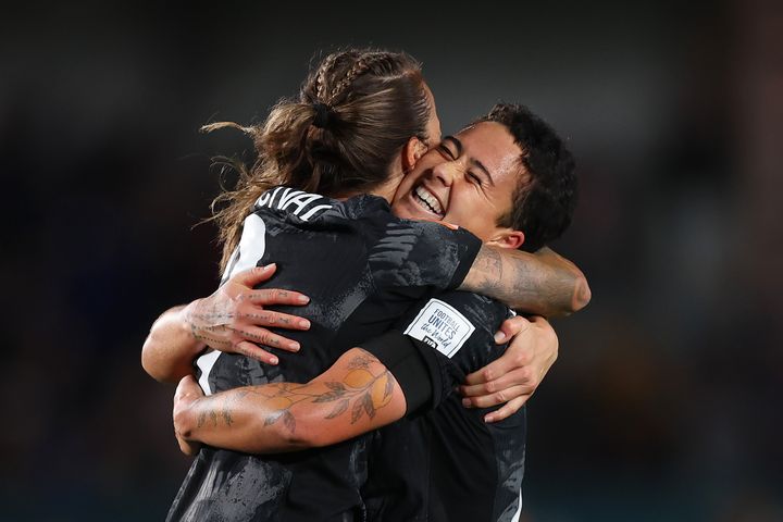 Ria Percival (L) and Malia Steinmetz (R) of New Zealand embrace after the team's historic 1-0 victory.