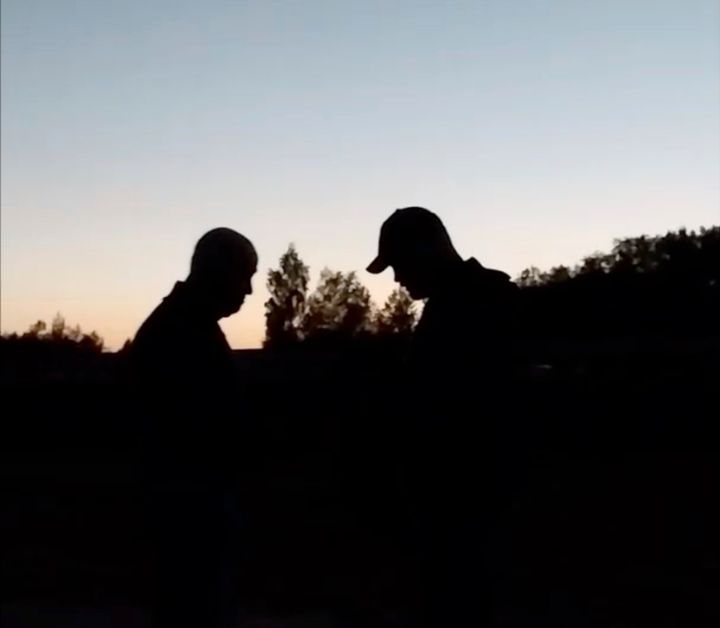 This image from video released Wednesday, July 19, 2023, appears to show Russian mercenary chief Yevgeny Prigozhin, left, for the first time since he led a short-lived rebellion in June. The grainy video of him speaking to troops at a field camp purportedly in Belarus, was posted on a messaging app channel linked to Prigozhin's Wagner private military company.