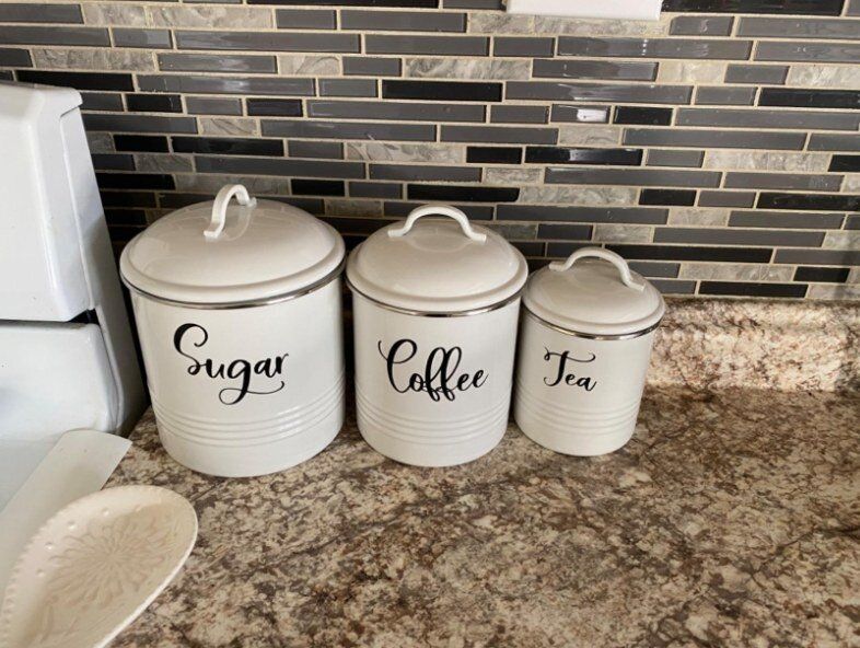 A three-piece farmhouse style kitchen canister set