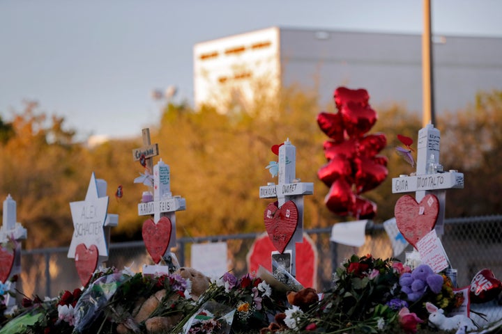 A memorial is made outside the Marjory Stoneman Douglas High School where 17 students and faculty were killed in a mass shooting in Parkland, Fla, Feb. 19, 2018. 