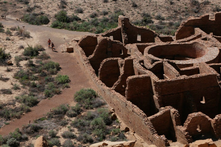 Visitors approach Pueblo Bonito, the largest archeological site at the Chaco Culture National Historical Park, in northwestern New Mexico, August 28, 2021.