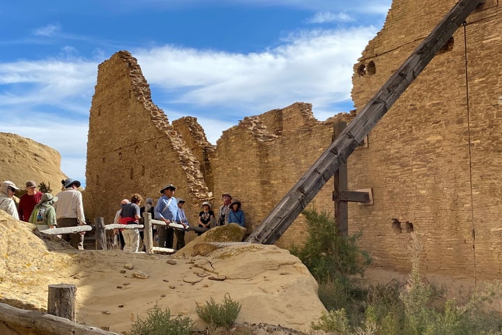 Tourists view Pueblo Bonito, one of a series of Puebloan structures in Chaco Culture National Historical Park believed to have been used as ceremonial as well as administrative and trading centers and built over multiple decades between the 9th and 12 centuries, in Chaco Canyon, New Mexico, U.S. October 21, 2021. 