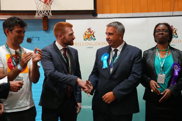 Conservative Party candidate Steve Tuckwell shakes hands with the Labour Party's Danny Beales after being announced winner in the Uxbridge and South Ruislip by-election.