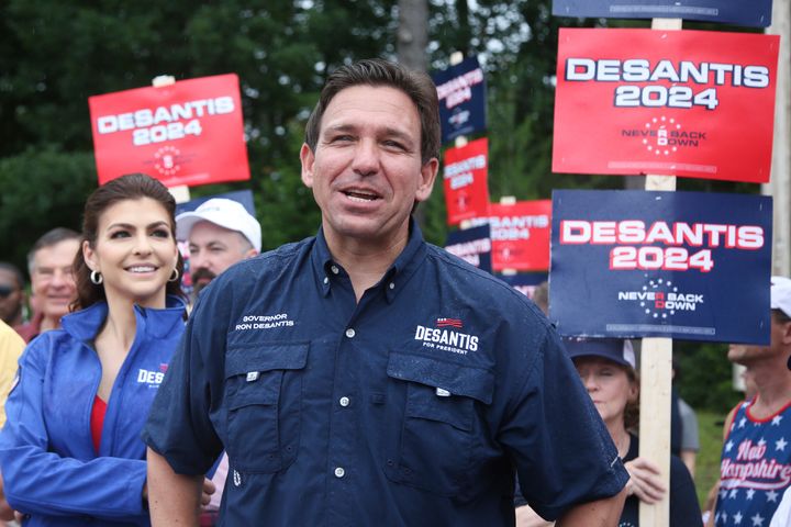 Republican presidential candidate Ron DeSantis and his wife, Casey, walk in the Fourth of July parade in Merrimack, New Hampshire. The Florida governor announces his bid for the White House in May.