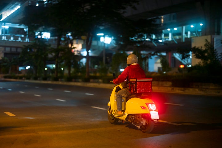 Food delivery drivers are driving to deliver products to customers who order online.