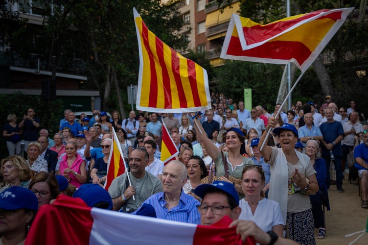 Popular Party supporters listen to their leader, Alberto Nunez Feijoo, during a campaigning meeting in Barcelona, Spain, Monday, July 17, 2023. Spain's general election Sunday, July 23 could make the country the latest European Union member to shift to the political right. Most polls put the right-wing Popular Party ahead of the Socialists but likely needing the support of the extreme right Vox party to form a government. (AP Photo/Emilio Morenatti)
