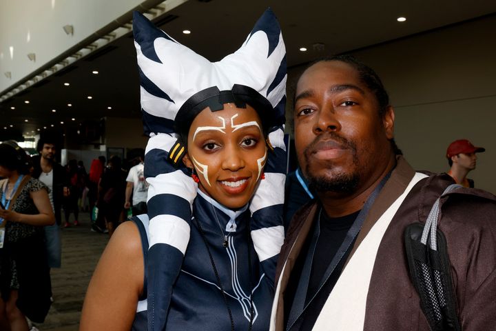 Aqura Lacey, of New York, dressed as Ashoka, left, and Jason Muse, of San Francisco, dressed as a Jedi Knight, from the "Star Wars" films.