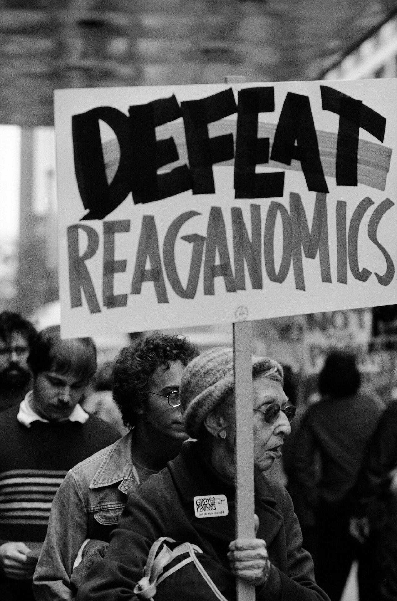 A demonstrator on Sept. 3, 1981, holds a "Defeat Reaganomics" sign down the street from the hotel in which President Ronald Reagan was staying in Chicago.