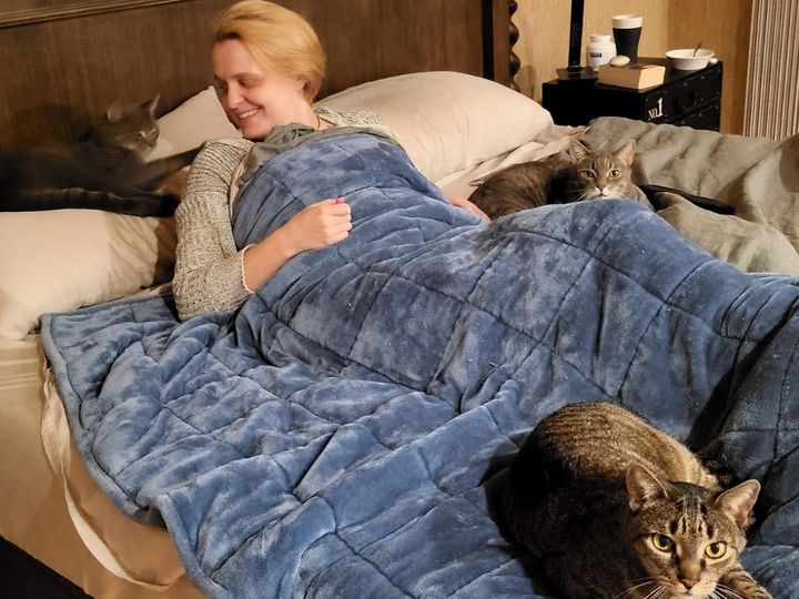The author with her cats (from left) Tony, Gandalf and Star in December 2022. "Although my long COVID has improved somewhat over time, daily rest is still essential," she writes.