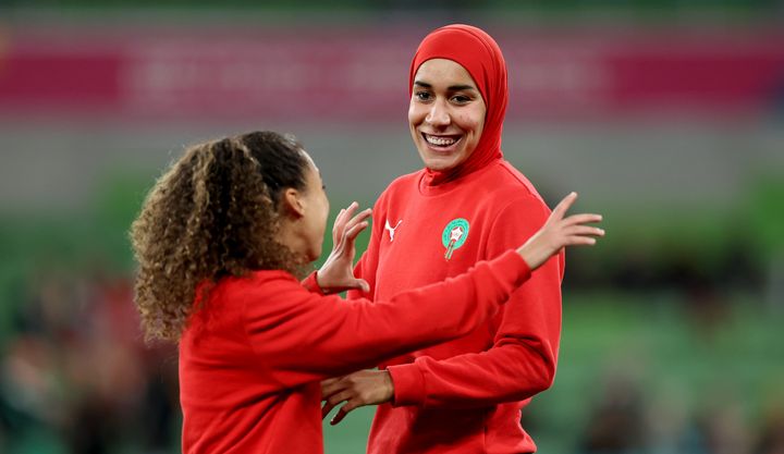 Nouhaila Benzina made history as the first footballer to wear a hijab at the World Cup, pictured above at the warm-up for Morocco's match against Germany.