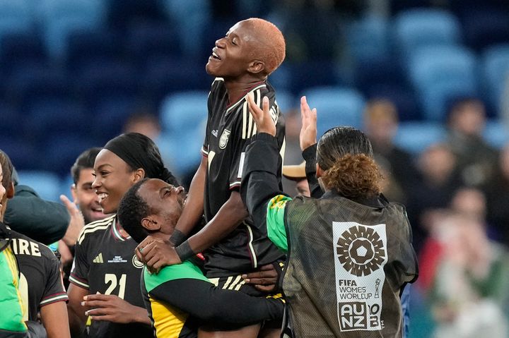 Jamaica's Deneisha Blackwood, center, celebrates with teammates and coaching staff after the Women's World Cup Group F soccer match between France and Jamaica at the Sydney Football Stadium in Sydney, Australia, on Sunday.