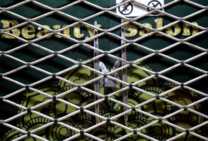 A lock is seen on a beauty salon door after Taliban announced bans beauty salons in Afghanistan, in the city of Kabul, on July 25, 2023. 