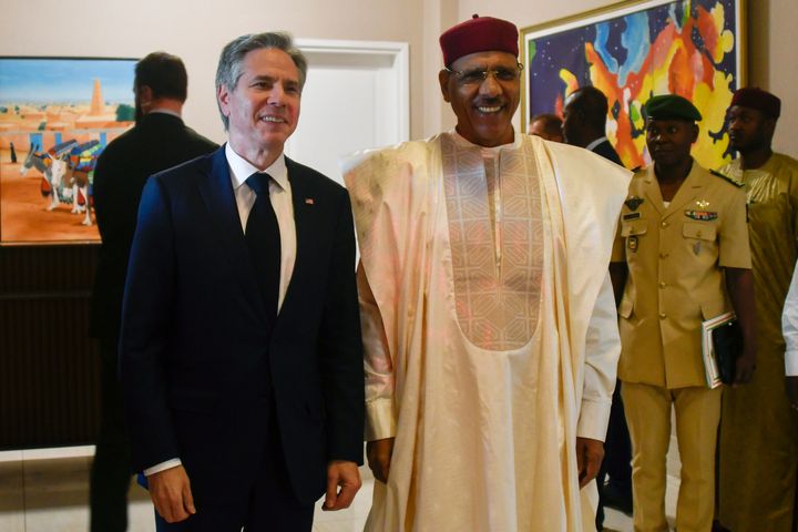 U.S. Secretary of State Antony Blinken, left, poses for a photo with Nigerien President Mohamed Bazoum during their meeting at the presidential palace in Niamey, Niger, March 16, 2023. 