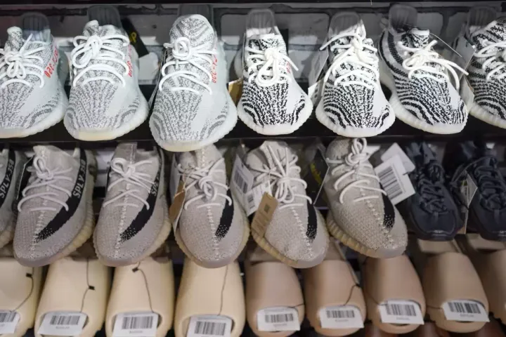 FILE - Yeezy shoes made by Adidas are displayed at Laced Up, a sneaker resale store, in Paramus, N.J., on Oct. 25, 2022. 