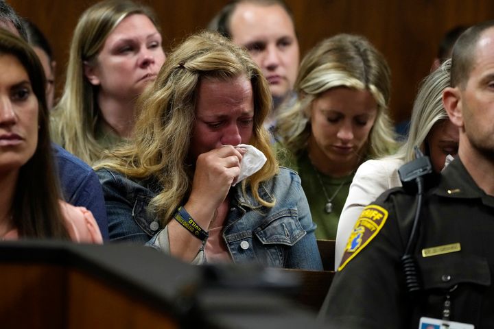 Sheri Myre, mother of slain Oxford student Tate Myre, weeps in court as the assistant principal at the school describes the shooting scene on Friday in Pontiac, Mich. 