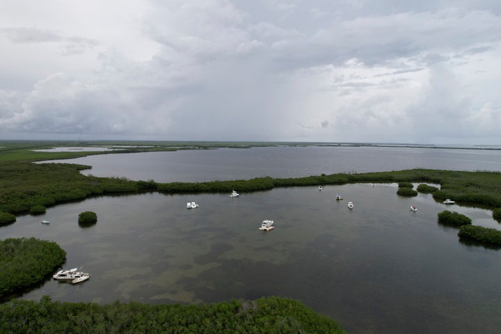 Boats are anchored at Manatee Bay off the Florida coast near Key Largo, on Friday, July 28, 2023.