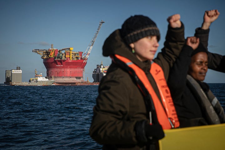 Activists of the environmental NGO Greenpeace participate in an action on a Shell platform, on the way to the North Sea, to expand an existing oil and gas field, off the coast of Cherbourg, northwestern France, on February 6, 2023.