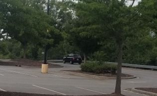 Police are searching for the driver of this black, midsize SUV after they say it struck a group of migrants outside a Walmart in Lincolnton, North Carolina, on Sunday.