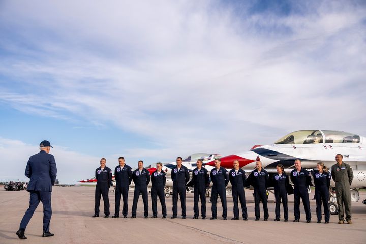 President Joe Biden greats a group of Thunderbird pilots after arriving at Peterson Space Force Base in Colorado Springs, Colo., Wednesday, May 31, 2023. Biden has decided to keep U.S. Space Command headquarters in Colorado, overturning a last-ditch decision by the Trump administration to move it to Alabama and ending months of politically fueled debate, according to senior U.S. officials.