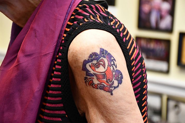 The design of the tattoo on her left upper arm is personal for DeLauro.