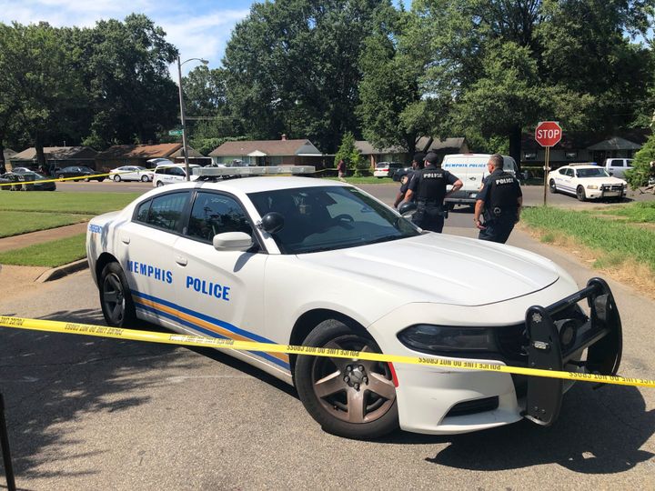 Memphis police officers work the scene of a shooting in Memphis on Monday. Police said officers shot a suspect after he attempted to enter a Jewish school with a gun and fired shots after he couldn't get into the building.
