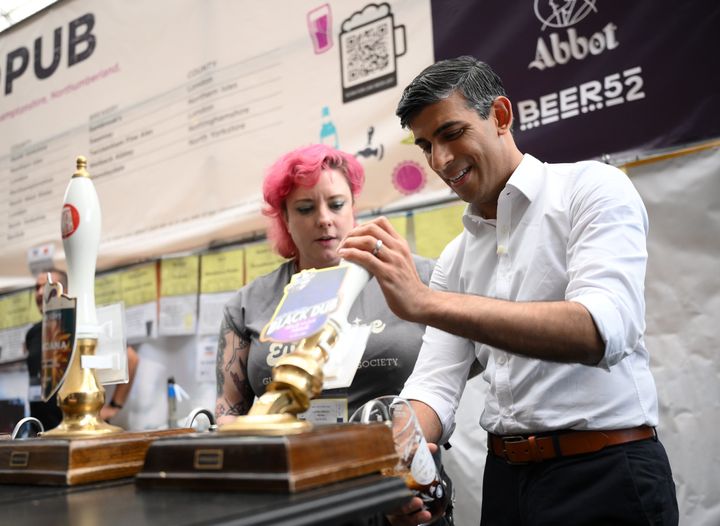 Rishi Sunak pours a pint of Black Dub stout during a visit to the Great British Beer Festival.
