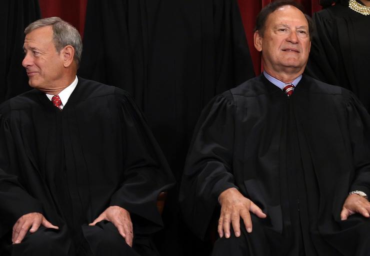 United States Supreme Court Chief Justice John Roberts (L) and Associate Justice Samuel Alito (R) pose for an official portrait at the East Conference Room of the Supreme Court building on October 7, 2022, in Washington, D.C. The Supreme Court has begun a new term after Associate Justice Ketanji Brown Jackson was officially added to the bench in September.