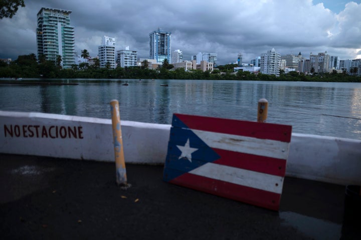 Blackouts darken waterfront buildings in San Juan, Puerto Rico.