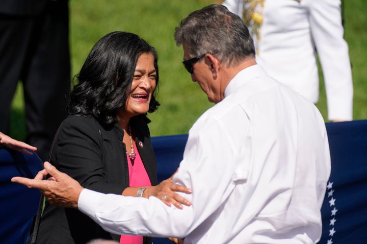 Rep. Pramila Jayapal (D-Wash.), who is affiliated with Justice Democrats and co-chairs the Congressional Progressive Caucus, speaks with Sen. Joe Manchin (D-W.Va.) in September. Justice Democrats' staff will have a smaller footprint on Capitol Hill going forward.