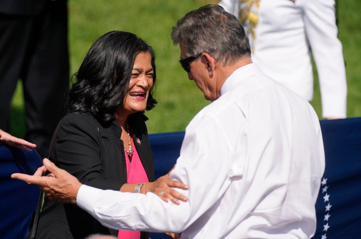 Rep. Pramila Jayapal (D-Wash.), who is affiliated with Justice Democrats and co-chairs the Congressional Progressive Caucus, speaks with Sen. Joe Manchin (D-W.Va.) in September. Justice Democrats' staff will have a smaller footprint on Capitol Hill going forward.