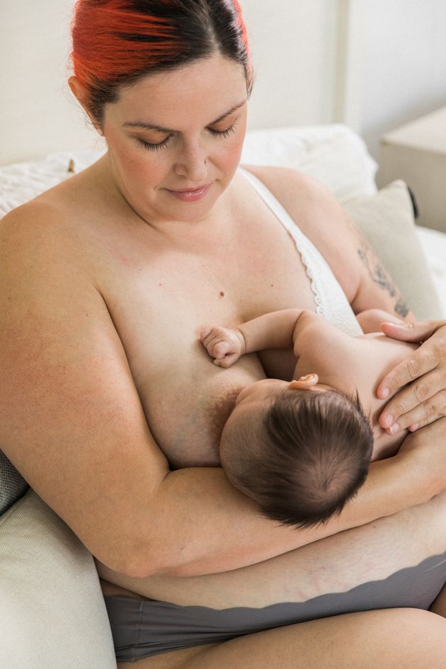 A baby feeding in the cradle position.