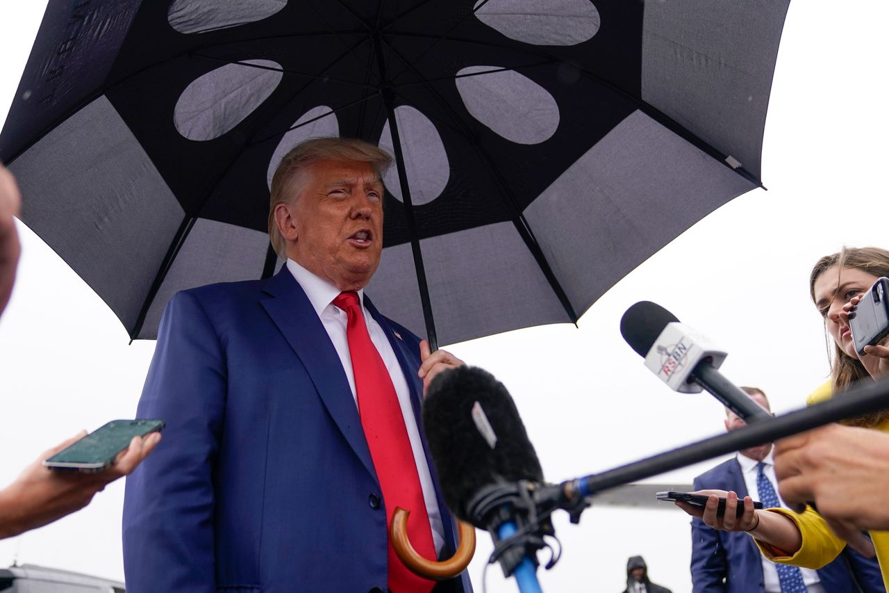 Trump speaks before he boards his plane at Ronald Reagan Washington National Airport.