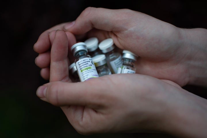 A transgender teen in Mississippi holds a supply of his testosterone medication on May 4.