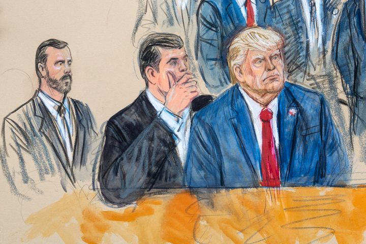 This artist sketch depicts former President Donald Trump, right, conferring with defense lawyer Todd Blanche, center, during his appearance at the Federal Courthouse in Washington, on Aug. 3, 2023. 