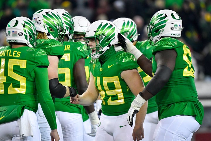 FILE -Oregon place kicker Camden Lewis (49) celebrates with teammates after kicking a field goal against Utah during the second half of an NCAA college football game Saturday, Nov. 19, 2022, in Eugene, Ore. The Big Ten has cleared the way for Oregon and Washington to apply for membership, four people familiar with the negotiations told The Associated Press., Friday, Aug. 4, 2023 (AP Photo/Andy Nelson, File)