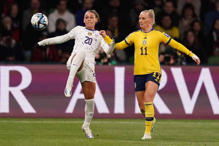 United States' Trinity Rodman, left, and Sweden's Stina Blackstenius battle for the ball during the Women's World Cup round of 16 soccer match between Sweden and the United States in Melbourne, Australia, Sunday, Aug. 6, 2023. (AP Photo/Scott Barbour)