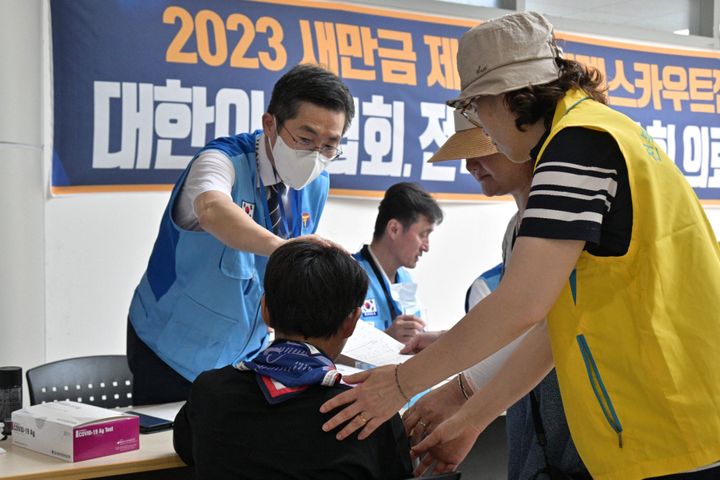 A scout (C) registers at the medical center of the World Scout Jamboree in Buan, North Jeolla province on Aug. 5, 2023. American and British scouts pulled out of the World Scout Jamboree in South Korea, citing scorching temperatures.