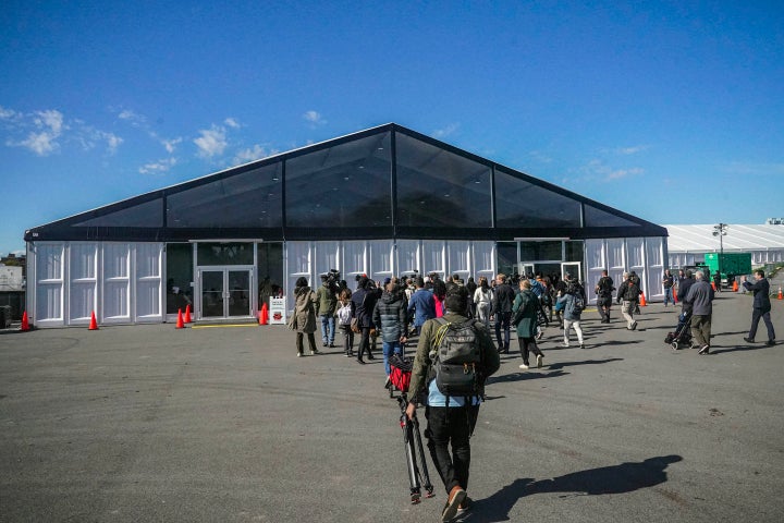 Media arrive for a tour at the Randalls Island Humanitarian Emergency Response and Relief Center, a complex of giant tents that opened last year for <a href="https://www.nytimes.com/2022/11/10/nyregion/migrant-shelter-randalls-island-close.html" target="_blank" role="link" class=" js-entry-link cet-external-link" data-vars-item-name="just a few weeks" data-vars-item-type="text" data-vars-unit-name="64d3fb1ce4b0677e504643dc" data-vars-unit-type="buzz_body" data-vars-target-content-id="https://www.nytimes.com/2022/11/10/nyregion/migrant-shelter-randalls-island-close.html" data-vars-target-content-type="url" data-vars-type="web_external_link" data-vars-subunit-name="article_body" data-vars-subunit-type="component" data-vars-position-in-subunit="0">just a few weeks</a> as Mayor Adams struggled with a plan to care for the migrants. Adams announced a plan this week to house as many as 2,000 migrants on Randalls Island. (AP Photo/Bebeto Matthews, File)