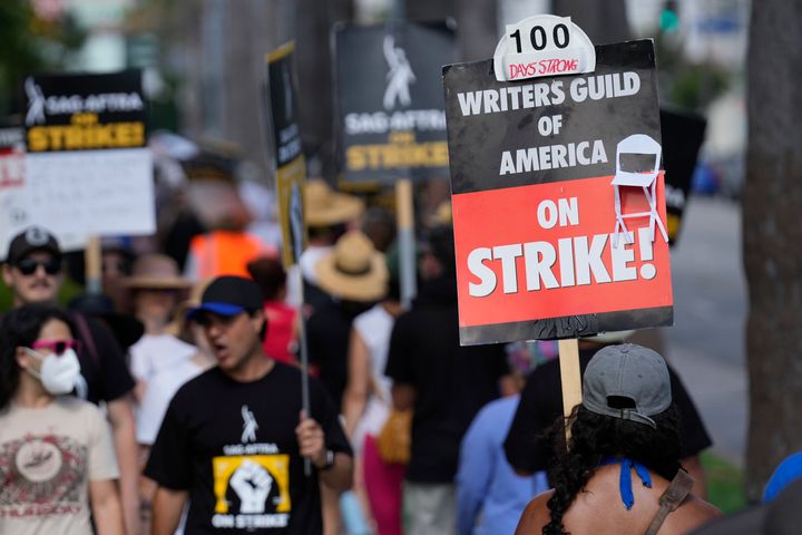 Picketers demonstrate on a line outside Netflix studios in Los Angeles on Wednesday. The Hollywood writers strike reached the 100-day mark as the U.S. film and television industries remain paralyzed by actors and screenwriters strikes.