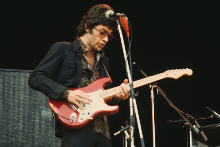 Canadian singer-songwriter and guitarist Robbie Robertson performing with The Band at Wembley, London, in 1974. 