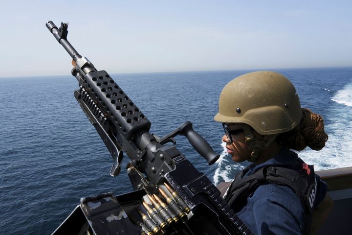 U.S. Navy retail service specialist Artayja Stewart of Tennessee stands guard next to a machine gun aboard the USS Paul Hamilton in the Strait of Hormuz in May. Thousands of Marines backed by the United States' top fighter jets, warships and other aircraft are slowly building up in the Persian Gulf. It's a sign that while America's wars in the region may be over, its conflict with Iran over its advancing nuclear program only continues to worsen with no solutions in sight.