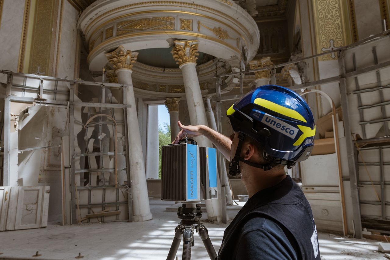 UNESCO conultant Sergiy Revenko shoots a documentary film with a laser camera after a Russian missile attack next to Transfiguration Cathedral in Odesa on July 31.