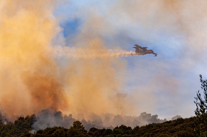 Zakynthos Island, canadair on action against a forest fire on the mounts around Keri
