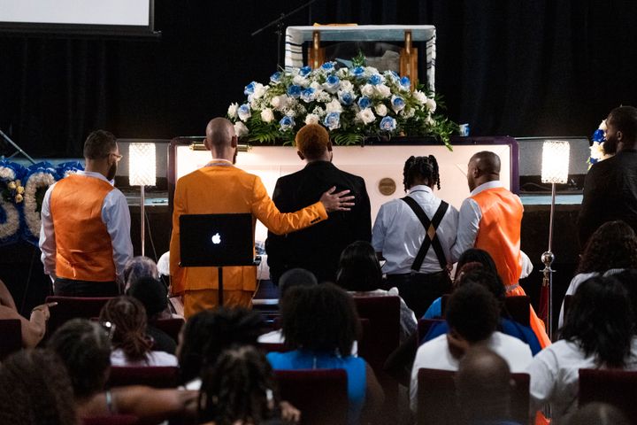 Friends of O'Shae Sibley gather by his casket during a celebration of life for O'Shae on Tuesday, Aug. 8, 2023, at The Met Philadelphia, in Philadelphia.