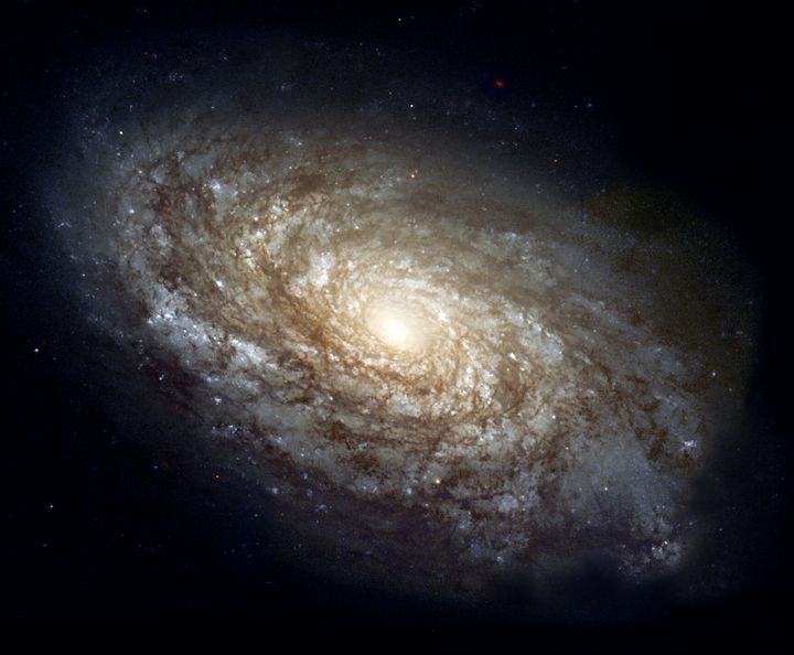 The majestic spiral galaxy NGC 4414 as photographed by the Hubble Space Telescope. (Photo by NASA)
