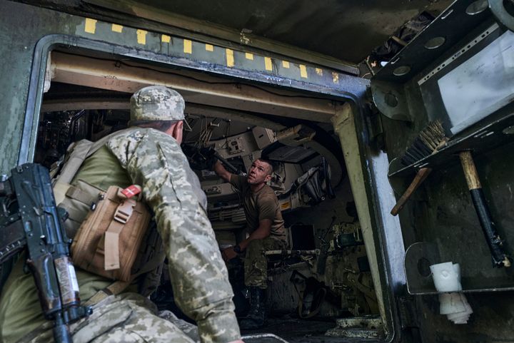 Ukrainian soldiers are seen inside a M109 self-propelled howitzer on the frontline in the Zaporizhzhya region, the site of the heaviest battles with the Russian troops, Ukraine, on Aug. 10, 2023.