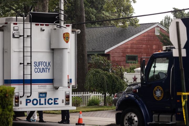 Crime laboratory officers are seen outside the home of Rex Heuermann in Massapequa Park, New York, on July 18.